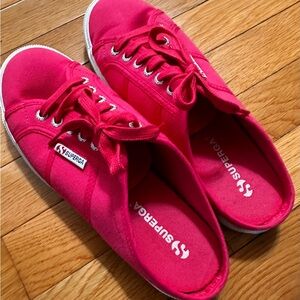 Hot pink Superga slide on sneakers.